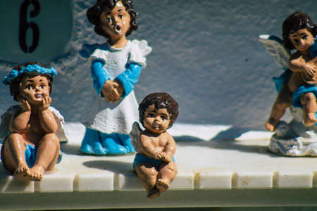 Seville Spain September 21, 2021 Typical graves in a Christian cemetery of the municipality of Carmona in Andalusia in southern Spain, the graves are made in the depth of a wall and richly decoratedのeditorial素材