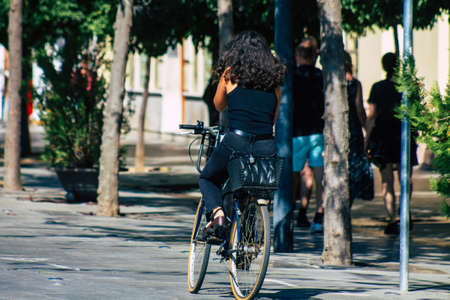 Seville Spain September 22, 2021 People rolling with a bicycle in the streets of Seville, an emblematic city and the capital of the region of Andalusia, in the south of Spainのeditorial素材