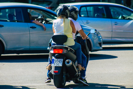 Seville Spain September 22, 2021 People rolling with a motorcycle in the streets of Seville, an emblematic city and the capital of the region of Andalusia, in the south of Spainのeditorial素材