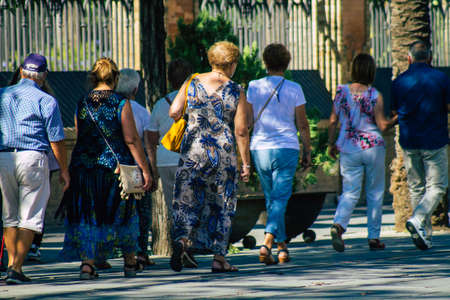 Seville Spain September 22, 2021 Pedestrians walking in the street during the coronavirus outbreak hitting Spain, wearing a mask is not mandatory but most people wear itのeditorial素材