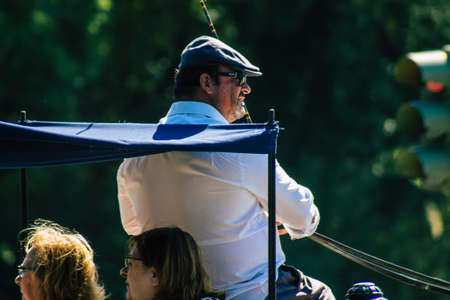 Seville Spain September 22, 2021 Horse drawn carriage ride through the streets of Seville during the coronavirus outbreak hitting Spain, wearing a mask is mandatoryのeditorial素材