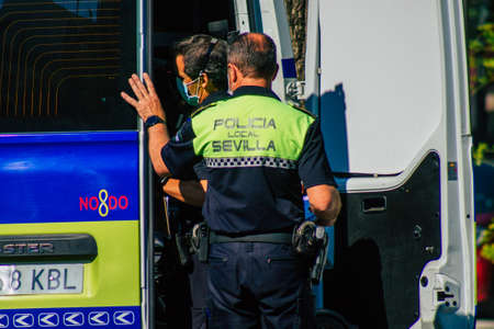 Seville Spain September 22, 2021 Police officer in the streets of Seville during the coronavirus outbreak hitting Spain, wearing a mask in the street is not mandatoryのeditorial素材