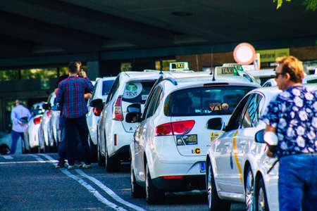 Seville Spain September 22, 2021 Taxi driving through the streets of Seville during the coronavirus outbreak hitting Spain, wearing a mask is mandatoryのeditorial素材
