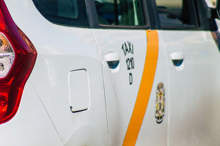 Seville Spain September 18, 2021 Taxi driving through the streets of Seville during the coronavirus outbreak hitting Spain, wearing a mask is mandatoryのeditorial素材