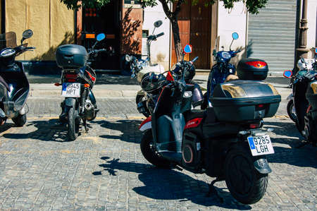 Seville Spain September 18, 2021 Motorcycles parked in the streets of Seville, an emblematic city and the capital of the region of Andalusia, in the south of Spainのeditorial素材