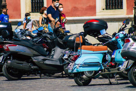 Seville Spain September 18, 2021 Motorcycles parked in the streets of Seville, an emblematic city and the capital of the region of Andalusia, in the south of Spainのeditorial素材