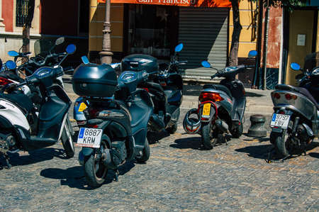 Seville Spain September 18, 2021 Motorcycles parked in the streets of Seville, an emblematic city and the capital of the region of Andalusia, in the south of Spainのeditorial素材