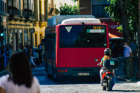 Seville Spain September 18, 2021 Bus driving through the streets of Seville during the coronavirus outbreak hitting Spain, wearing a mask is mandatoryのeditorial素材