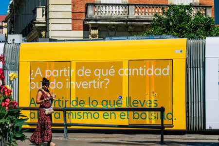 Seville Spain September 18, 2021 Modern electric tram for passengers rolling through the streets of Seville during the coronavirus outbreak hitting Spain, wearing a mask is mandatoryのeditorial素材