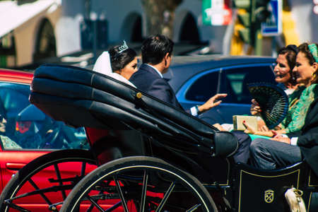 Seville Spain September 18, 2021 Horse drawn carriage ride through the streets of Seville during the coronavirus outbreak hitting Spain, wearing a mask is mandatoryのeditorial素材