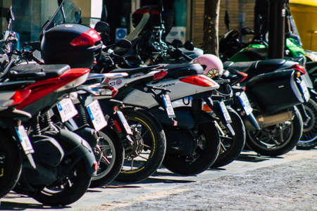 Seville Spain September 18, 2021 Motorcycles parked in the streets of Seville, an emblematic city and the capital of the region of Andalusia, in the south of Spainのeditorial素材