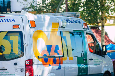 Seville Spain September 18, 2021 Ambulance driving through the streets of Seville during the coronavirus outbreak hitting Spain, wearing a mask is mandatoryのeditorial素材