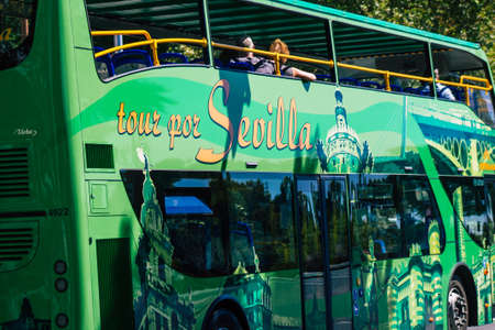 Seville Spain September 18, 2021 Tourist bus driving through the streets of Seville during the coronavirus outbreak hitting Spain, wearing a mask is mandatoryのeditorial素材