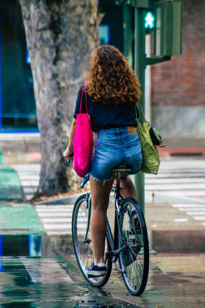 Seville Spain September 15, 2021 People rolling with a bicycle in the streets of Seville, an emblematic city and the capital of the region of Andalusia, in the south of Spainのeditorial素材