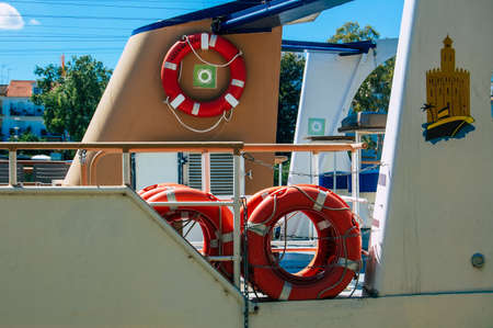 Seville Spain September 18, 2021 Tourist boats on the Guadalquivir River that crosses Seville, an emblematic city and the capital of the region of Andalusia, in the south of Spainのeditorial素材