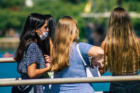 Seville Spain September 18, 2021 Pedestrians walking in the street during the coronavirus outbreak hitting Spain, wearing a mask is not mandatory but most of people wear itのeditorial素材