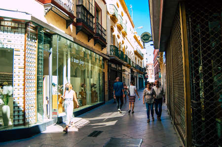 Seville Spain September 18, 2021 Pedestrians walking in the street during the coronavirus outbreak hitting Spain, wearing a mask is not mandatory but most of people wear itのeditorial素材
