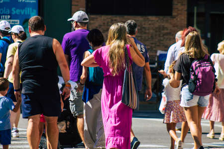 Seville Spain September 18, 2021 Pedestrians walking in the street during the coronavirus outbreak hitting Spain, wearing a mask is not mandatory but most of people wear itのeditorial素材