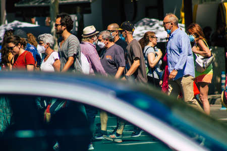 Seville Spain September 18, 2021 Pedestrians walking in the street during the coronavirus outbreak hitting Spain, wearing a mask is not mandatory but most of people wear itのeditorial素材