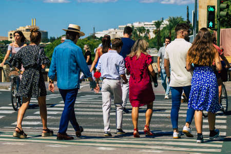 Seville Spain September 18, 2021 Pedestrians walking in the street during the coronavirus outbreak hitting Spain, wearing a mask is not mandatory but most of people wear itのeditorial素材