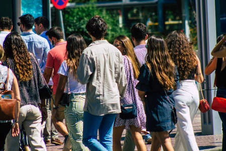 Seville Spain September 18, 2021 Pedestrians walking in the street during the coronavirus outbreak hitting Spain, wearing a mask is not mandatory but most of people wear itのeditorial素材