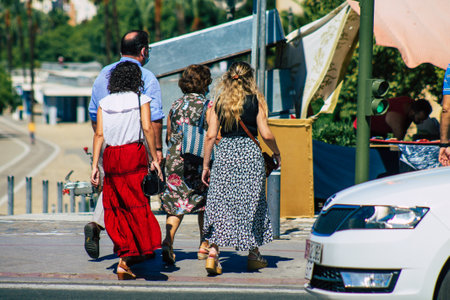 Seville Spain September 18, 2021 Pedestrians walking in the street during the coronavirus outbreak hitting Spain, wearing a mask is not mandatory but most of people wear itのeditorial素材