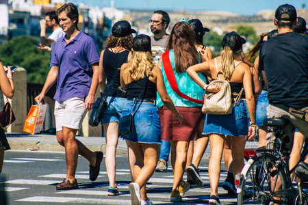 Seville Spain September 18, 2021 Pedestrians walking in the street during the coronavirus outbreak hitting Spain, wearing a mask is not mandatory but most of people wear itのeditorial素材