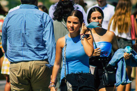 Seville Spain September 18, 2021 Pedestrians walking in the street during the coronavirus outbreak hitting Spain, wearing a mask is not mandatory but most of people wear itのeditorial素材