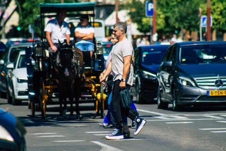 Seville Spain September 18, 2021 Pedestrians walking in the street during the coronavirus outbreak hitting Spain, wearing a mask is not mandatory but most of people wear itのeditorial素材