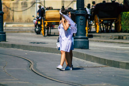 Seville Spain September 18, 2021 Pedestrians walking in the street during the coronavirus outbreak hitting Spain, wearing a mask is not mandatory but most of people wear itのeditorial素材