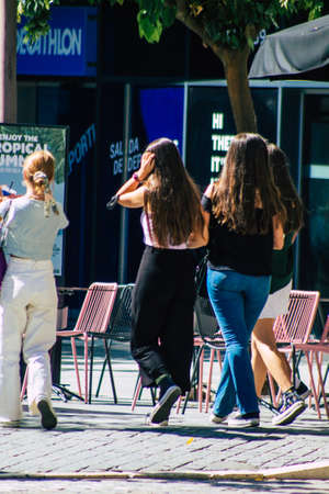 Seville Spain September 18, 2021 Pedestrians walking in the street during the coronavirus outbreak hitting Spain, wearing a mask is not mandatory but most of people wear itのeditorial素材