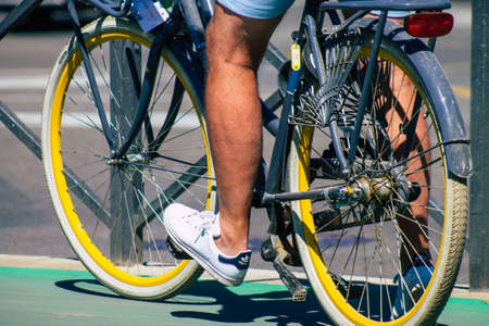 Seville Spain September 18, 2021 People rolling with a bicycle in the streets of Seville, an emblematic city and the capital of the region of Andalusia, in the south of Spainのeditorial素材