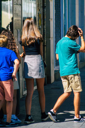 Seville Spain September 18, 2021 Pedestrians walking in the street during the coronavirus outbreak hitting Spain, wearing a mask is not mandatory but most of people wear itのeditorial素材