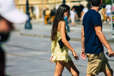 Seville Spain September 18, 2021 Pedestrians walking in the street during the coronavirus outbreak hitting Spain, wearing a mask is not mandatory but most of people wear itのeditorial素材