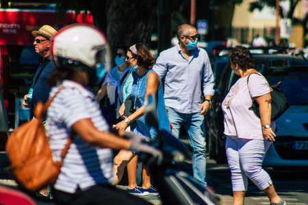 Seville Spain September 18, 2021 Pedestrians walking in the street during the coronavirus outbreak hitting Spain, wearing a mask is not mandatory but most of people wear itのeditorial素材