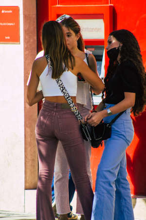Seville Spain September 18, 2021 Pedestrians walking in the street during the coronavirus outbreak hitting Spain, wearing a mask is not mandatory but most of people wear itのeditorial素材