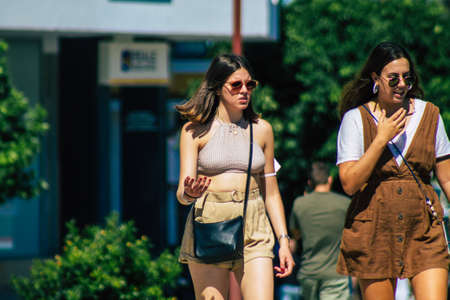 Seville Spain September 18, 2021 Pedestrians walking in the street during the coronavirus outbreak hitting Spain, wearing a mask is not mandatory but most of people wear itのeditorial素材