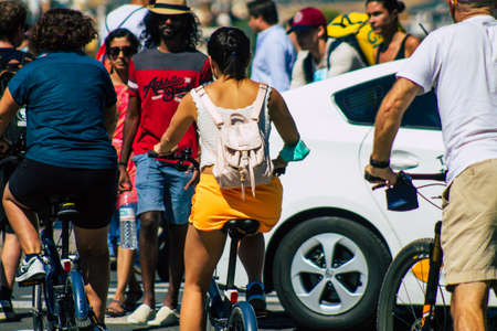 Seville Spain September 18, 2021 People rolling with a bicycle in the streets of Seville, an...