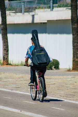 Seville Spain September 18, 2021 People rolling with a bicycle in the streets of Seville, an emblematic city and the capital of the region of Andalusia, in the south of Spainのeditorial素材