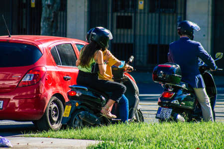 Seville Spain September 18, 2021 People rolling with a motorcycle in the streets of Seville, an emblematic city and the capital of the region of Andalusia, in the south of Spainのeditorial素材