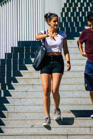 Seville Spain September 18, 2021 Pedestrians using an escalator during the coronavirus outbreak hitting Spain, wearing a mask is not mandatory but most of people wear itのeditorial素材
