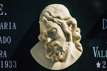 Seville Spain September 21, 2021 Typical graves in a Christian cemetery of the municipality of Carmona in Andalusia in southern Spain, the graves are made in the depth of a wall and richly decoratedのeditorial素材