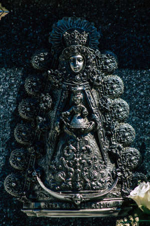 Seville Spain September 21, 2021 Typical graves in a Christian cemetery of the municipality of Carmona in Andalusia in southern Spain, the graves are made in the depth of a wall and richly decoratedのeditorial素材