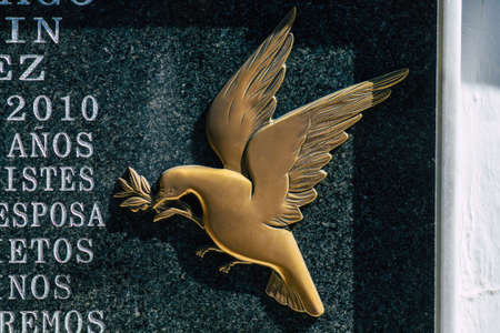 Seville Spain September 21, 2021 Typical graves in a Christian cemetery of the municipality of Carmona in Andalusia in southern Spain, the graves are made in the depth of a wall and richly decoratedのeditorial素材