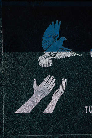 Seville Spain September 21, 2021 Typical graves in a Christian cemetery of the municipality of Carmona in Andalusia in southern Spain, the graves are made in the depth of a wall and richly decoratedのeditorial素材