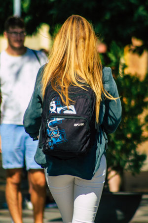 Seville Spain September 22, 2021 People rolling with an electric scooter in the streets of Seville, operating with a small utility internal combustion engines and a deck in the centerのeditorial素材