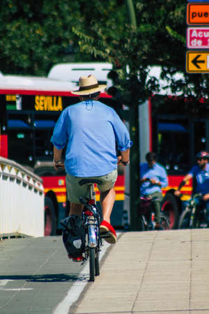 Seville Spain September 22, 2021 People rolling with a bicycle in the streets of Seville, an emblematic city and the capital of the region of Andalusia, in the south of Spainのeditorial素材