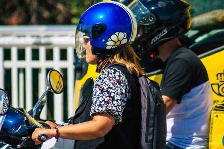 Seville Spain September 22, 2021 People rolling with a motorcycle in the streets of Seville, an emblematic city and the capital of the region of Andalusia, in the south of Spainのeditorial素材