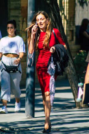 Seville Spain September 22, 2021 Unidentified woman walking in the street during the coronavirus outbreak hitting Spain, wearing a mask is not mandatory but most people wear itのeditorial素材