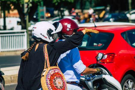 Seville Spain September 22, 2021 People rolling with a motorcycle in the streets of Seville, an emblematic city and the capital of the region of Andalusia, in the south of Spainのeditorial素材